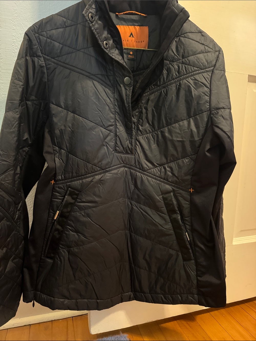Basin and Range Black Quilted Pullover Jacket with Orange Trim